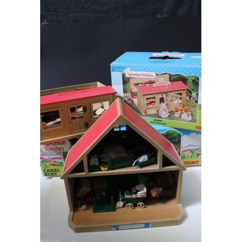 230 - Tomy Sylvanian Families to include boxed Bakery, 
boxed Canal Boat, Chalet, quantity of figures incl... 