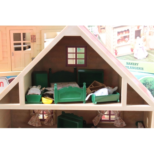 230 - Tomy Sylvanian Families to include boxed Bakery, 
boxed Canal Boat, Chalet, quantity of figures incl... 