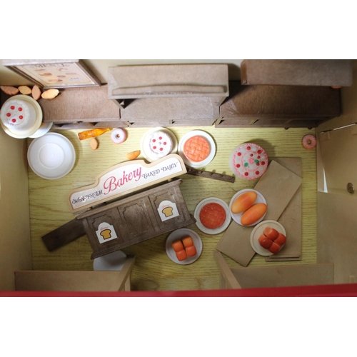 230 - Tomy Sylvanian Families to include boxed Bakery, 
boxed Canal Boat, Chalet, quantity of figures incl... 