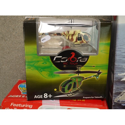 350 - A collection of mixed toys to include a boxed Palitoy Family Tree House, Infrared control helicopter... 