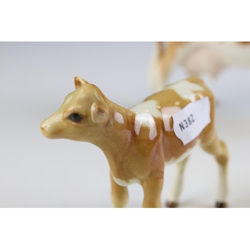 104 - Beswick Guernsey Cow, first version, model 1248a together with a Beswick Guernsey Calf, model 1249a