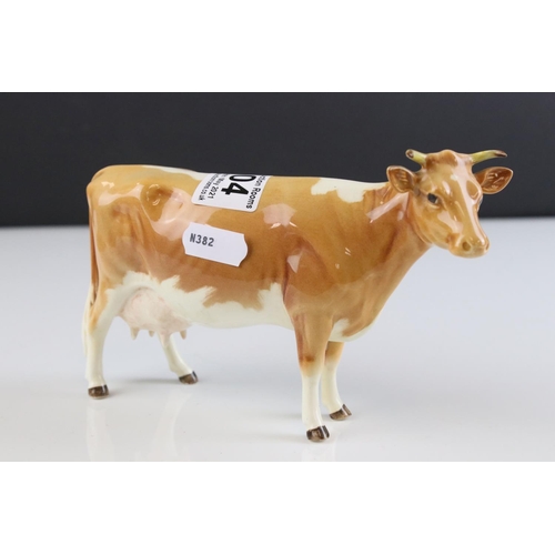 104 - Beswick Guernsey Cow, first version, model 1248a together with a Beswick Guernsey Calf, model 1249a