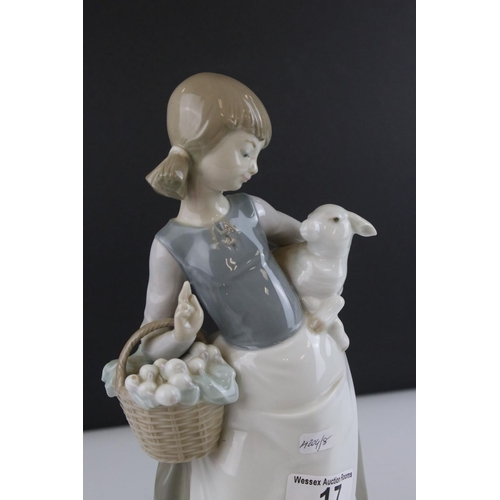 17 - Lladro figure 4835, girl with a lamb in her arms and carrying a basket