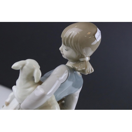 17 - Lladro figure 4835, girl with a lamb in her arms and carrying a basket