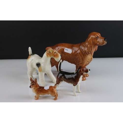 24 - Four Beswick Dogs including Corgi, Beagle, Cocker Spaniel and Terrier, walking