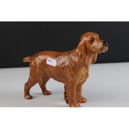 24 - Four Beswick Dogs including Corgi, Beagle, Cocker Spaniel and Terrier, walking