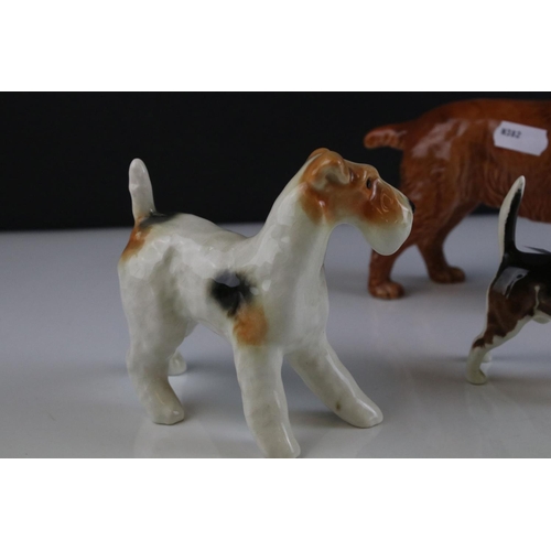 24 - Four Beswick Dogs including Corgi, Beagle, Cocker Spaniel and Terrier, walking