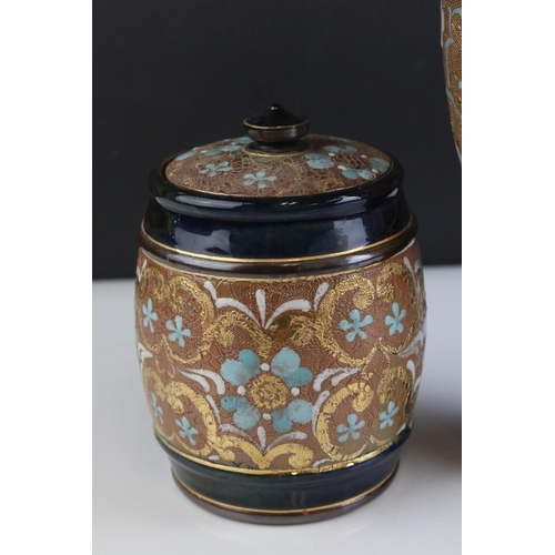 27 - Early 20th century Royal Doulton Stoneware Vase, 26cms high and Lidded Tobacco Jar, 15cms high, both... 