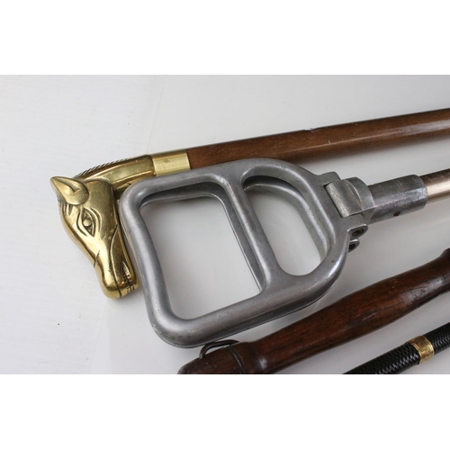 71 - Walking stick with a brass horses's head handle, together with a riding crop, a long handled shoe ho... 