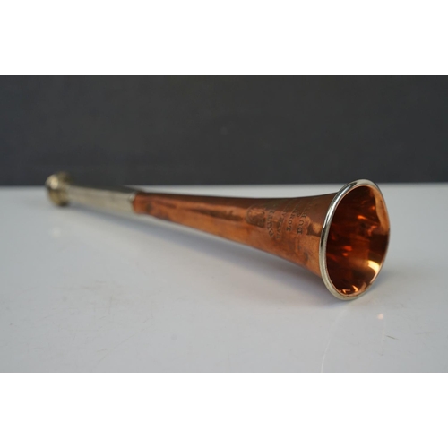 179 - A copper hunting horn with nickel mouthpiece marked 'Butler' Haymarket London & Dublin.