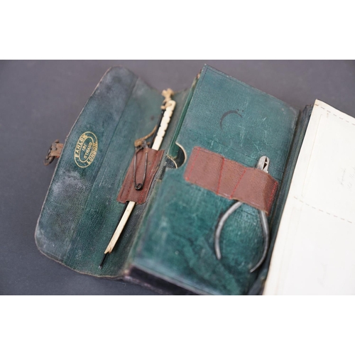 182 - A Farlow leather fishing tackle case complete with tackle, dated 1910.