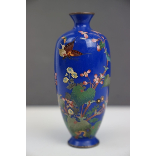 184 - An Oriental blue enamel vase with butterfly and floral decoration. Part of an extensive collection o... 