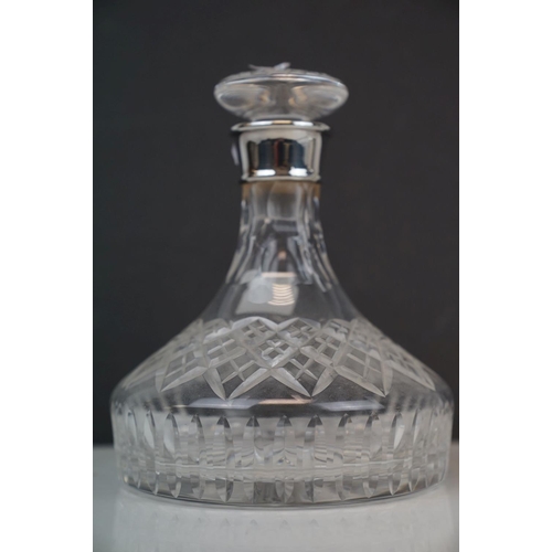 192 - Two glass decanters with fully hallmarked sterling silver collars to include a ships decanter.