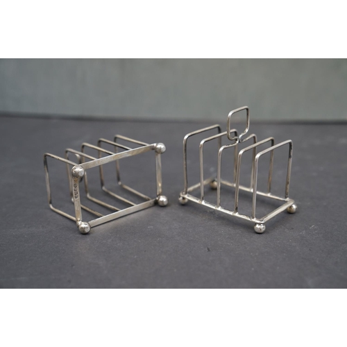 196 - A pair of fully hallmarked sterling silver toast racks, maker marked for William Hutton & Sons, Birm... 