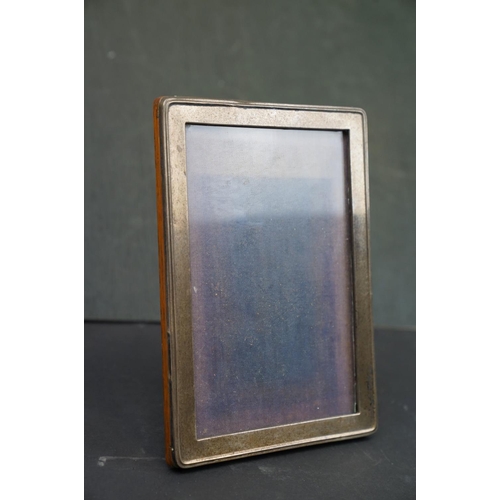 204 - A group of collectables to include a fully hallmarked sterling silver photograph frame and a hallmar... 