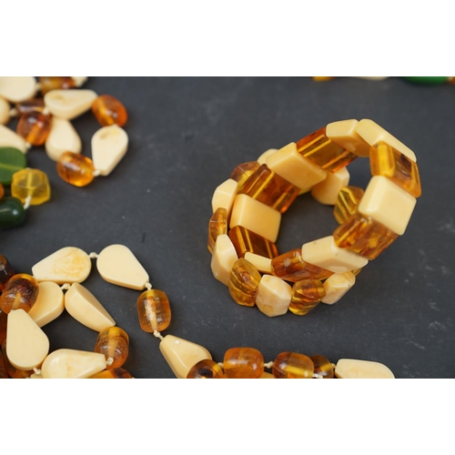 213 - Large quantity of amber style necklaces and bracelets