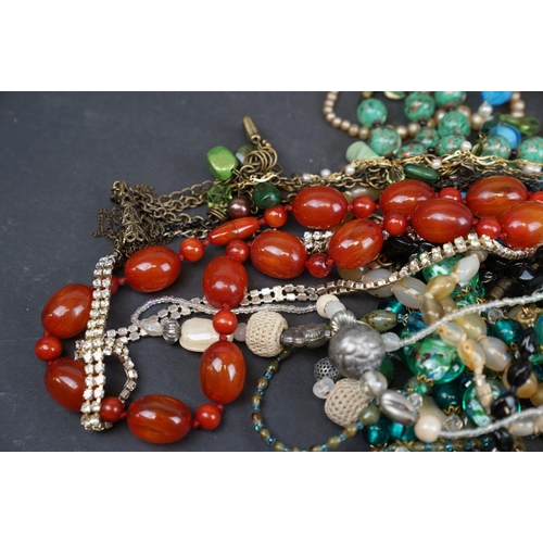 215 - A small collection of costume jewellery to include vintage and contemporary examples.