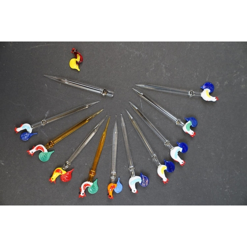 220 - A collection of vintage Glass cocktail sticks with Hen finials.