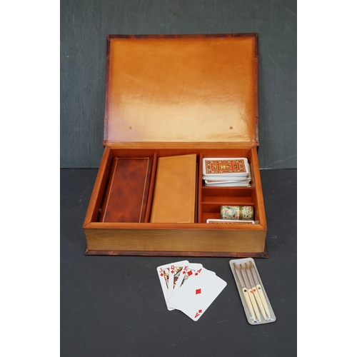 223 - A cased Bridge set to include playing cards, score books and pens contained within a book shaped box... 