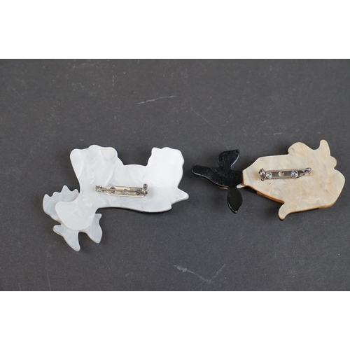 228 - Two Lea Stein style dog brooches.