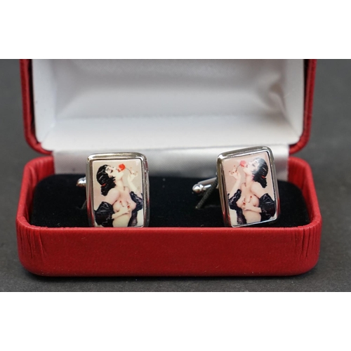 231 - Pair of silver and enamel cufflinks depicting nude lady, stamped Sterling