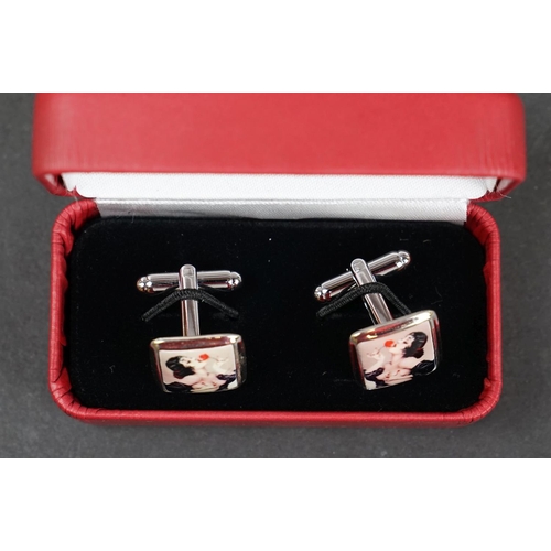 231 - Pair of silver and enamel cufflinks depicting nude lady, stamped Sterling