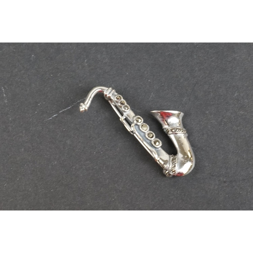 238 - Silver saxophone brooch set with marcasites, stamped 925