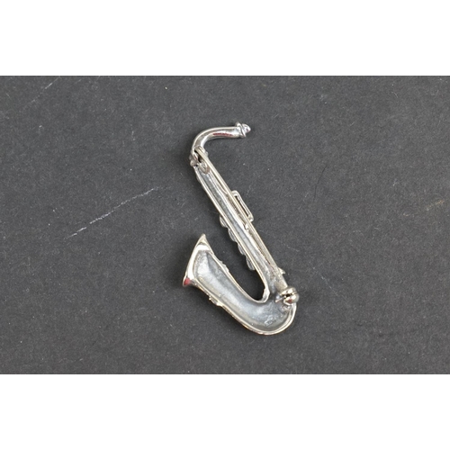 238 - Silver saxophone brooch set with marcasites, stamped 925