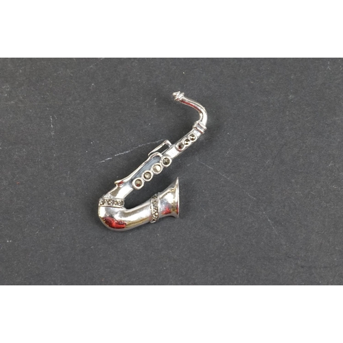 238 - Silver saxophone brooch set with marcasites, stamped 925