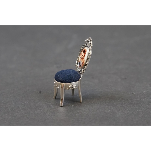 240 - Silver and enamel pincushion in the form of a chair, stamped Sterling