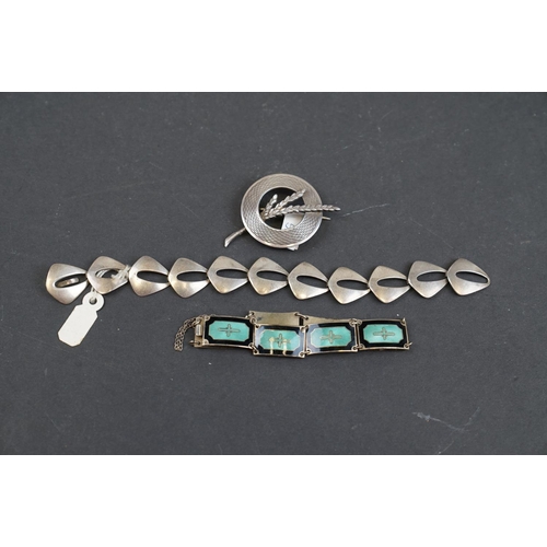 244 - A collection of sterling silver mid century jewellery to include a scottish silver brooch and two Sc... 