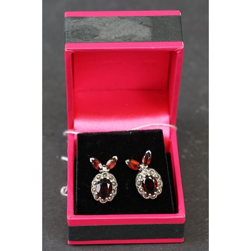 267 - Pair of silver and garnet set earrings, stamped 925