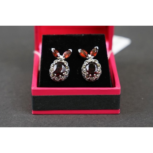 267 - Pair of silver and garnet set earrings, stamped 925