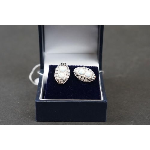 272 - Pair of silver and opal stud earrings set with CZs, stamped 925