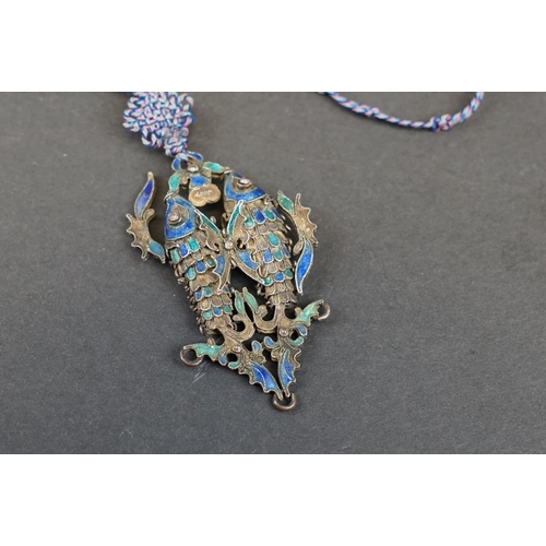 274 - A vintage Chinese white metal and enamel double fish pendant on hand knotted silk chain.