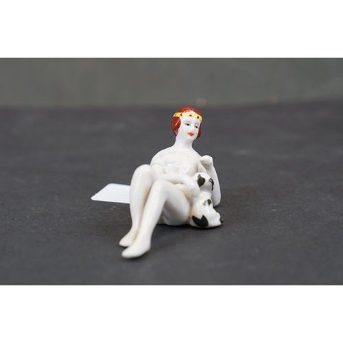 286 - Ceramic pin doll in the form of a lady and a dog