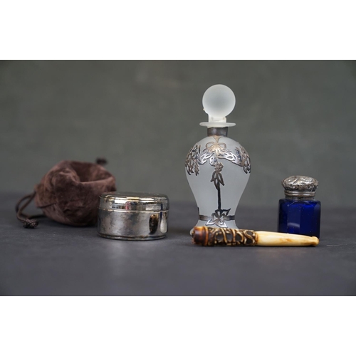 289 - Two scent bottles with white metal mounts together with a trinket box and a bone cheroot holder.