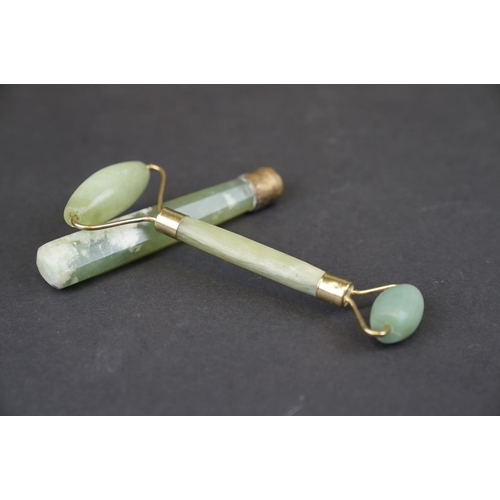 293 - A oriental Jade double ended roller with brass mounts together with a Jade handle.