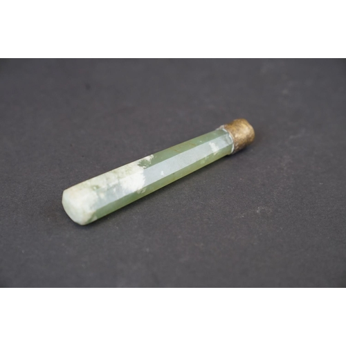 293 - A oriental Jade double ended roller with brass mounts together with a Jade handle.