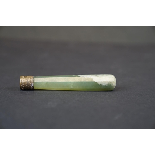 293 - A oriental Jade double ended roller with brass mounts together with a Jade handle.