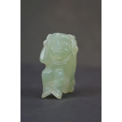 303 - A oriental carved Jade ornament of two circus performers.