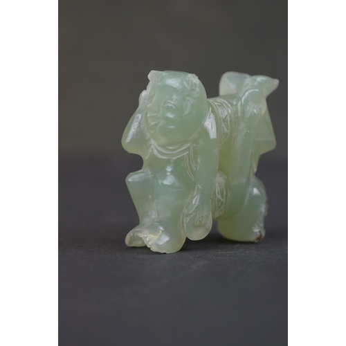 303 - A oriental carved Jade ornament of two circus performers.