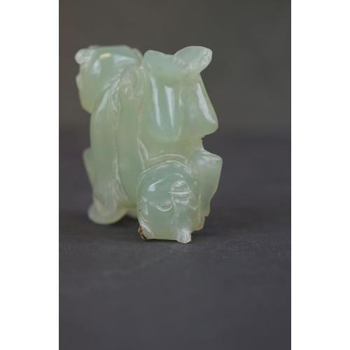 303 - A oriental carved Jade ornament of two circus performers.