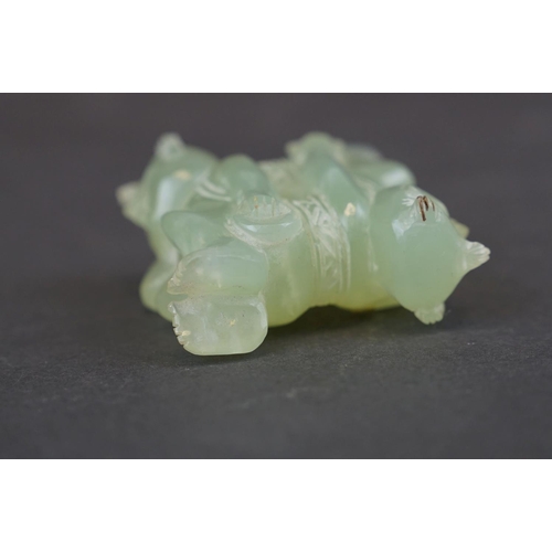 303 - A oriental carved Jade ornament of two circus performers.