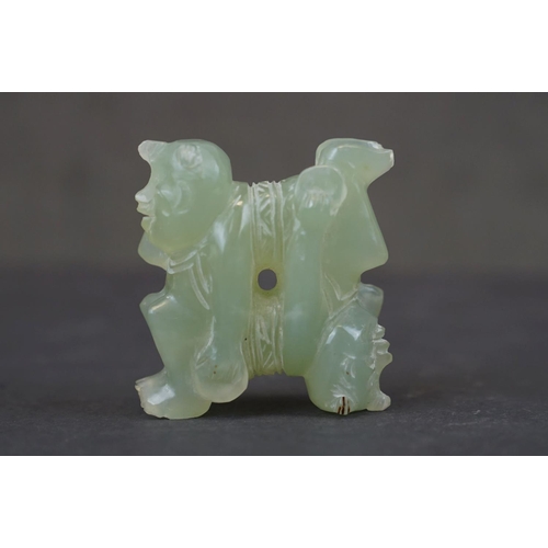 303 - A oriental carved Jade ornament of two circus performers.