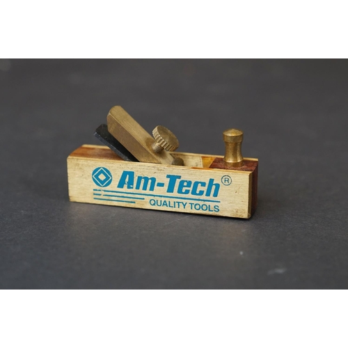 307 - A cased set of AM-Tech miniature wood working tools to include wood plane and set squares.