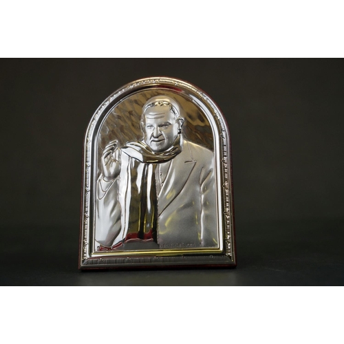 308 - A collection of four continental silver religious icons to include the last supper.