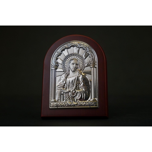 308 - A collection of four continental silver religious icons to include the last supper.