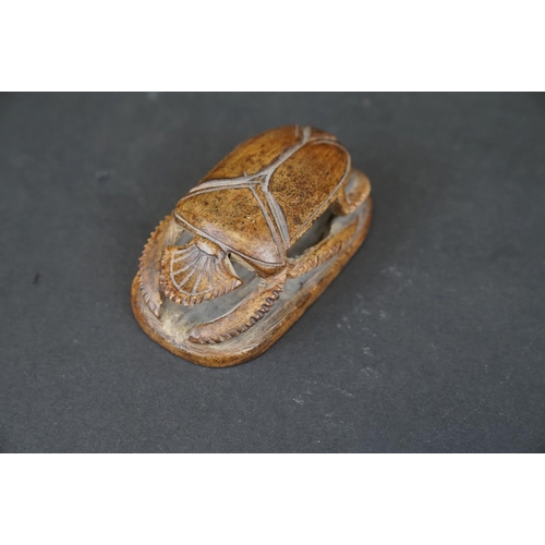 309 - A carved stone Egyptian ornament of a scarab beetle.