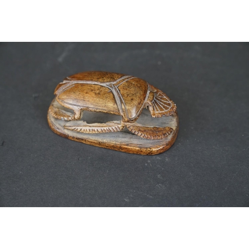 309 - A carved stone Egyptian ornament of a scarab beetle.